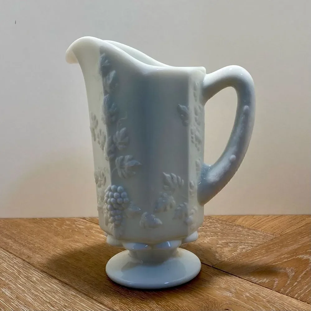 Vintage Pedestal Milk Glass Handled Pitcher 9” Tall Grapes & Leaves
